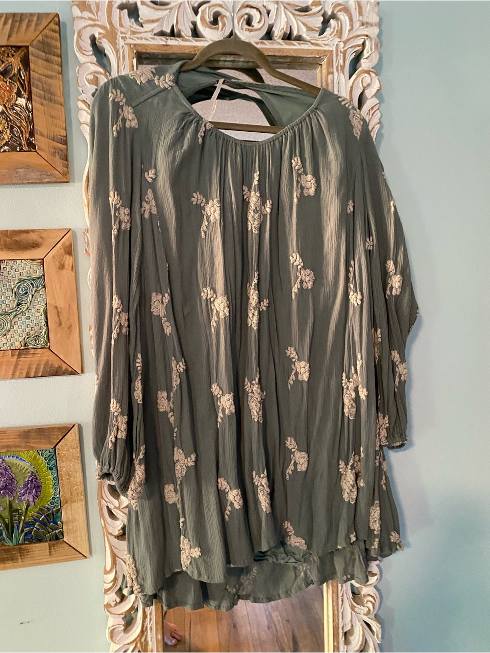 Free People sage green knit top with bronze-tone tag